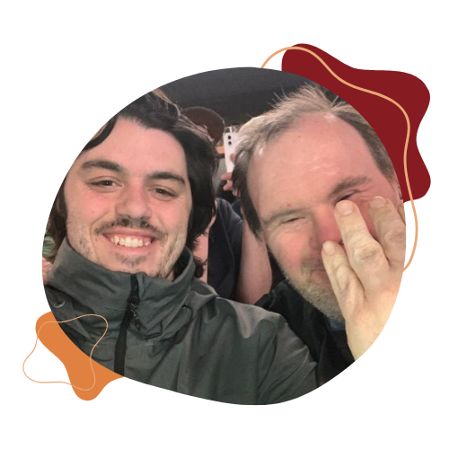 Logan Roszel smiles for a photo with a participant
