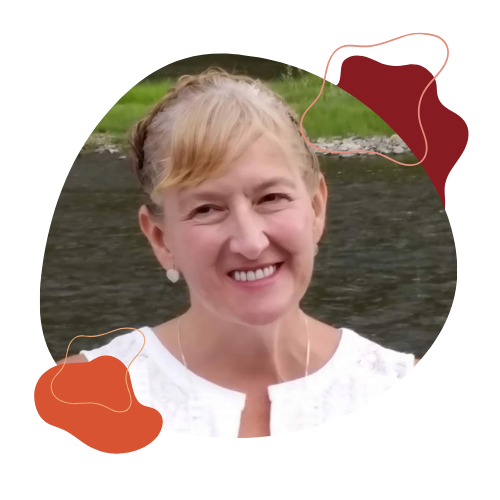 Michelle Cook smiles with a river in the background